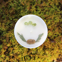 Load image into Gallery viewer, The top of the Flourishing Forest candle by Emerald Hearth.  The top of the candle has green quartz and spruce tips.