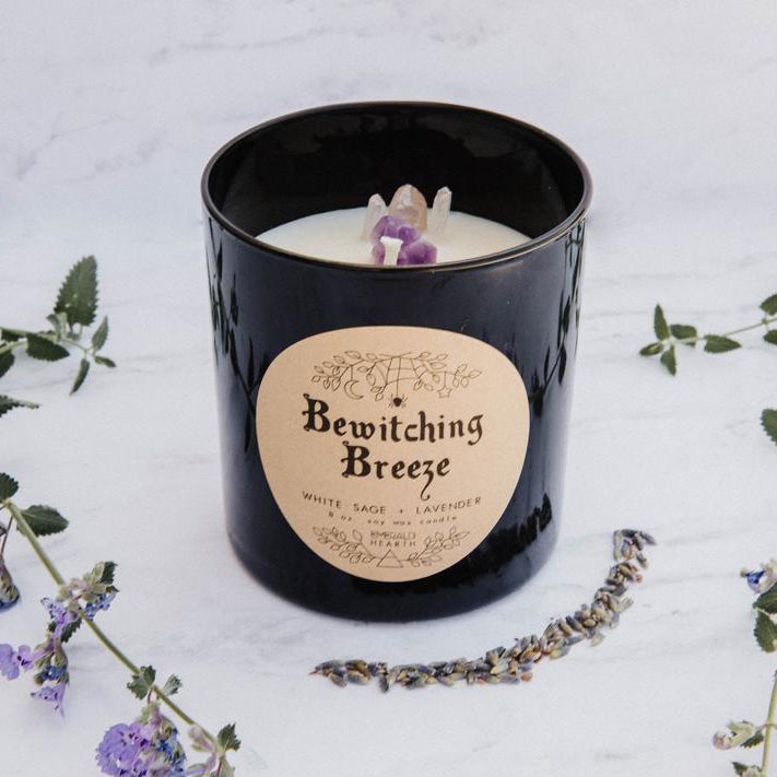 The black version of the bewitching breeze candle by emerald hearth.