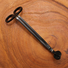 Load image into Gallery viewer, A photo of the black wick trimmer by emerald hearth photographed on wood.
