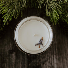Load image into Gallery viewer, The top of the bewitching breeze mini candle by emerald hearth.  It has lavender on the top.