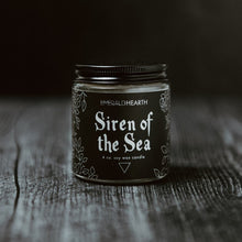 Load image into Gallery viewer, Front of the Siren of the Sea candle.  The candle&#39;s packaging is black.  This candle pulls inspiration from the ocean.