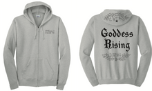 Laden Sie das Bild in den Galerie-Viewer, A product image of the front and back of the gray Emerald Hearth hoodie which features the words Emerald Hearth on the front top left and the word Goddess Rising in the center of the back. The hoodie also has a spider web detail across the hood.