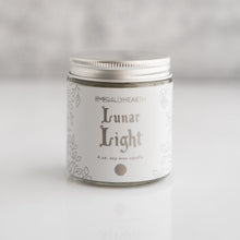 Load image into Gallery viewer, Front view of the Lunar Light candle by Emerald Hearth.  The candle has white packaging.