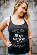 Load image into Gallery viewer, A woman wearing an Emerald Hearth tank top that says Magic Surrounds Me.
