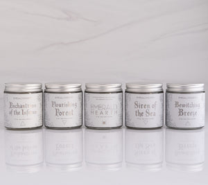 Five candles in the essential mini candle bundle set on a white background.  All candles are made by emerald hearth.